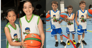 Kids having fun and learning basketball skills during a Little Boomers Basketball session on the court