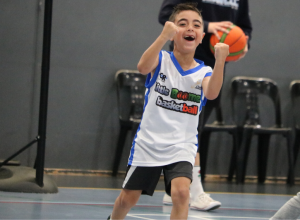 happy kid playing basketball